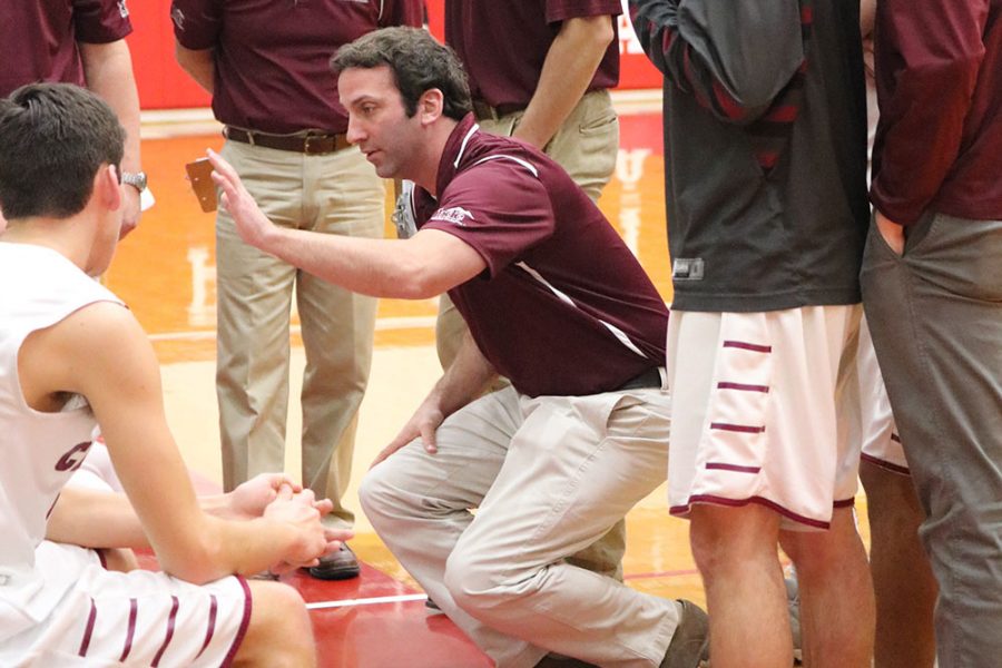 HUDDLE+-+During+a+timeout%2C+Mr.+Dave+Mullaney%2C+boys%E2%80%99+varsity+basketball+coach%2C+gives+his+team+a+pep+talk.+Mr.+Mullaney+won+his+200th+game+against+Lehighton+January+3.+%E2%80%9CIf+you%E2%80%99re+fortunate+enough+to+stay+at+a+place+for+a+long+period%2C+you+will+eventually+accumulate+some+wins%2C%E2%80%9D+Mr.+Mullaney+said.%0A