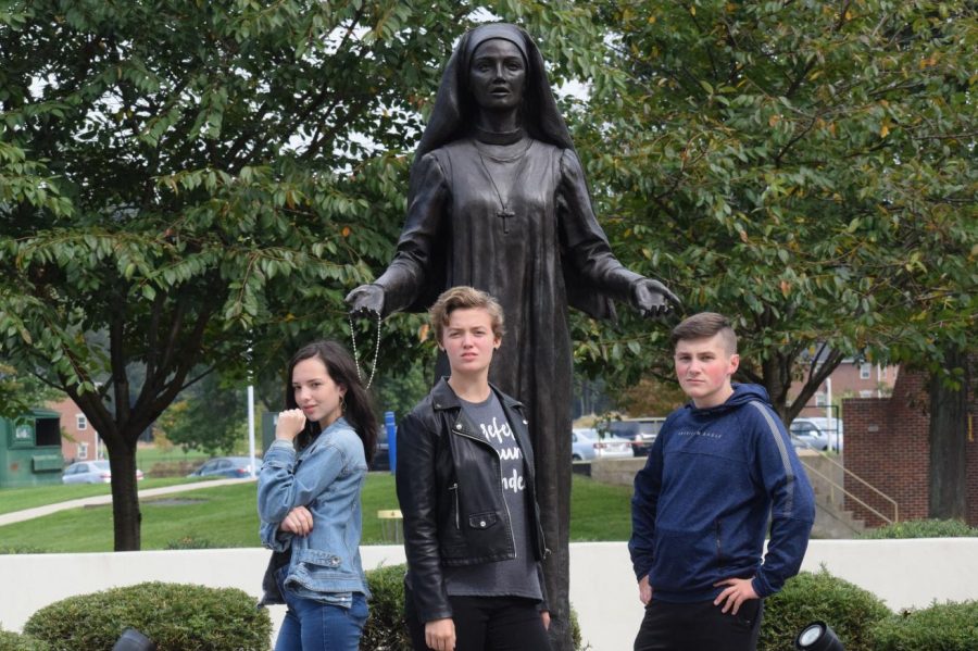 In+front+of+a+statue+of+Jane+Frances+de+Chantal%2C+sophomores+Lily+McDonald%2C+Kendra+Speak%2C+and+Jake+Montgomery+pose+for+the+camera.+The+Drama+Club%2C+Stage+Crew%2C+and+Dramatic+Literature+class+went+on+a+field+trip+to+DeSales+University+to+watch+a+Shakespeare+play.+%E2%80%9CIt+was+nice+to+see+profesional+actors+so+we+can+learn+from+them+and+do+better.+The+show+was+good+and+fresh%2C%E2%80%9D+Autumn+McDonough%2C+senior+said.%0A