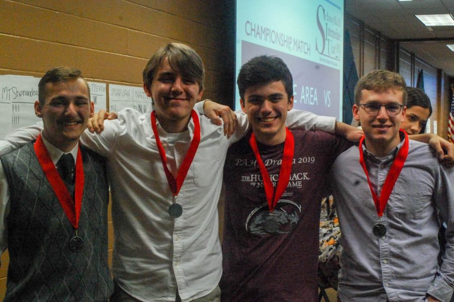 Juniors+Kenny+Gore%2C+Eli+Brennan%2C+senior+Evan+Spevak+and+junior+Noah+Fredricks+show+off+their+second+place+medals+at+the+Schuylkill+Quiz+Team+Championship.