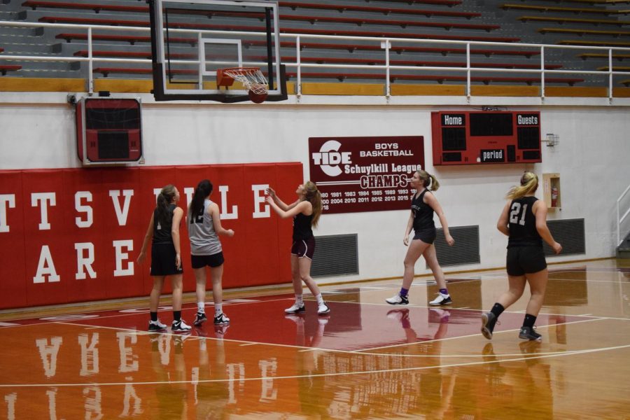 Sophomore+Julia+Plachko+stands+under+the+net+waiting+to+receive+the+ball+at+practice+in+the+2018-2019+season.+Many+players+like+Plachko+are+returning+this+season+with+a+new+coach.+Plachko+said%2C+%22I+am+looking+forward+to+playing+with+all+the+girls+and+having+a+lot+of+fun.%22