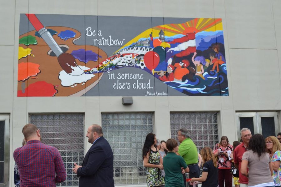 The+Walk+In+Art+Center+and+the+students+of+Pottsville+Area+School+District+worked+together+to+paint+a+brand+new+mural.+It+now+hangs+on+the+wall+of+the+Ned+Hampford+Natatorium.+Dr.+Jeffrey+Zwiebel%2C+superintendent+said%2C+%22It+involved+as+many+students+as+we+could+from+all+three+buildings+and+I%27m+hoping+it+gives+the+students+a+sense+of+pride+and+ownership+in+our+school+district.%22