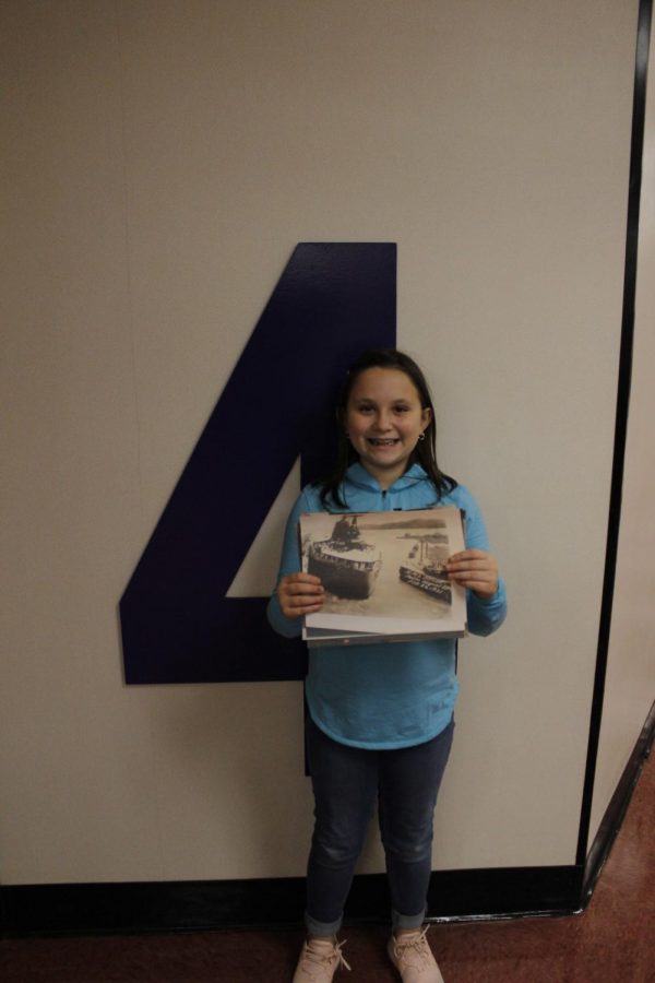 Fourth+grader%2C+Hadley+Hermany%2C+holds+a+photo+that+her+great-grandfather+took+during+World+War+II.+He+was+stationed+in+Germany+during+World+War+II.+Hermany+said%2C+%22I+hope+to+be+like+my+great-grandfather+when+I+am+older+and+make+the+world+a+better+place.%22