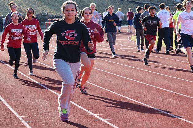 Junior+Erin+Cleary+runs+around+the+track+during+the+first+week+of+practices.+The+track+team+got+only+five+practices+in+before+storm+Stella+hit.+%E2%80%9CMy+goal+for+this+year+is+to+make+it+to+districts.+%E2%80%9CI+work+hard+at+practice+every+day+and+try+to+get+my+height+up+for+pole+vault%2C%E2%80%9D+Cleary+said.+%0A