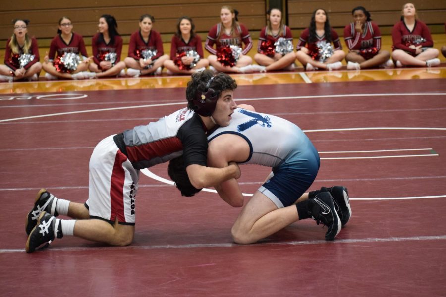 On+the+wrestling+mat%2C+junior+Nick+Onea+looks+to+turn+his+opponent.+Onea+and+the+Crimson+Tide+defeated+Blue+Mountain+on+senior+night+by+a+score+of+34-32.+%E2%80%9CI+knew+I+just+had+to+stay+on+my+offense+and+wrestle+smart%2C%E2%80%9D+Onea+said.