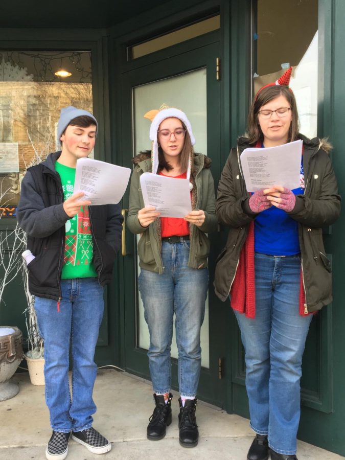 Junior+Jake+Montgomery%2C+sophomore+Alyssa+Sheriff+and+Junior+Julia+Malek+sing+Christmas+carols+in+front+of+the+Majestic+Theatre+in+downtown+Pottsville.+The+PAHS+Crimson+Players+spent+time+singing+for+%22small+business+Saturday%22+on+Saturday+November+30.+